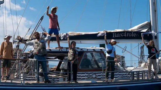 Six activists standing on board the Madleen
