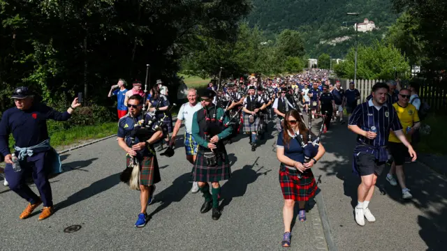 Scotland fans march to the stadium ahead of an International Friendly match between Liechtenstein and Scotland at Rheinpark Stadion