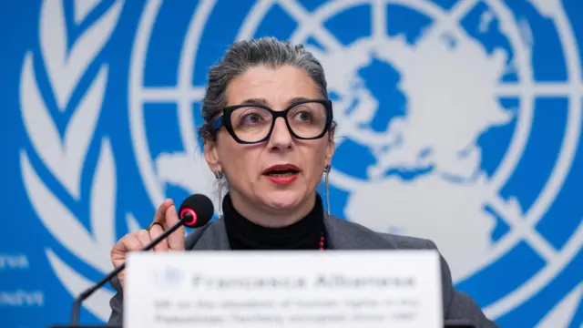 Francesca Albanese speaking in to microphone