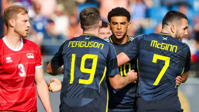 Che Adams celebrates