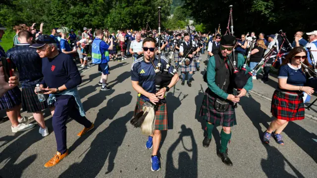 Scotland fans march to the stadium ahead of an International Friendly match between Liechtenstein and Scotland at Rheinpark Stadion