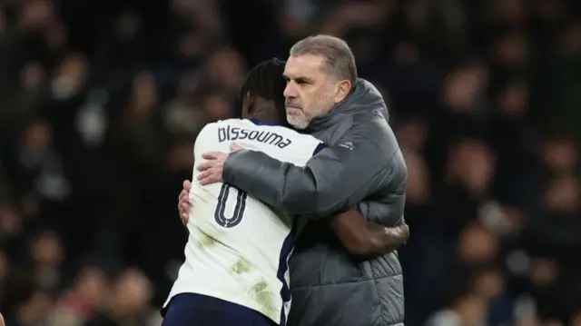Yves Bissouma and Ange Postecoglou hugging