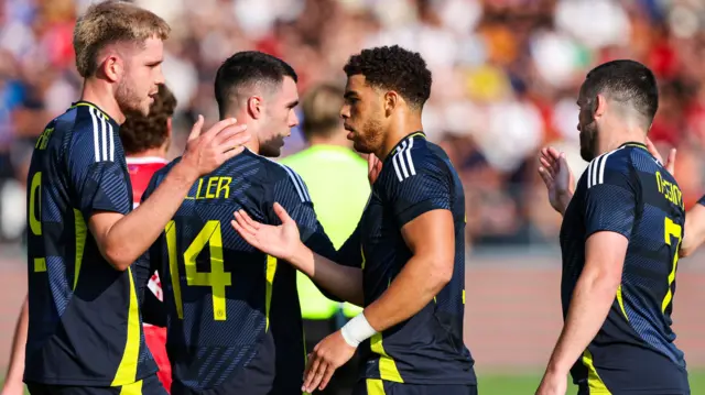 Che Adams celebrates