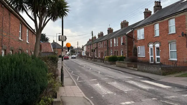 A street in Leiston, houses line either side of the road.