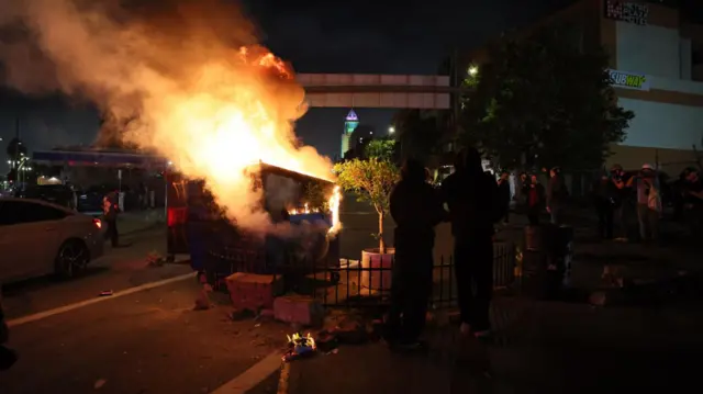 A wheely bin on fire in Los Angeles on Sunday night
