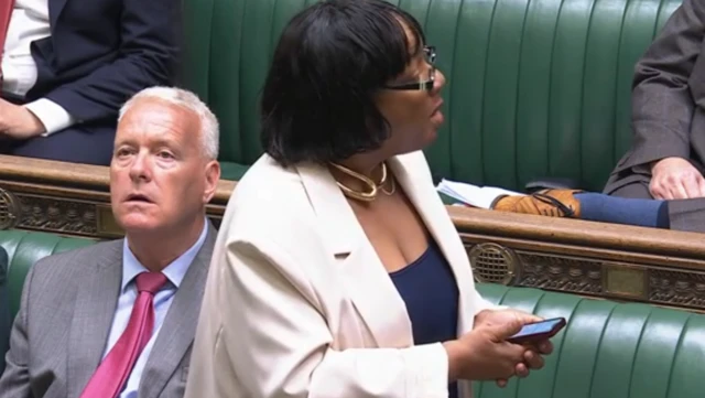 Diane Abbott in COmmons in white jacket