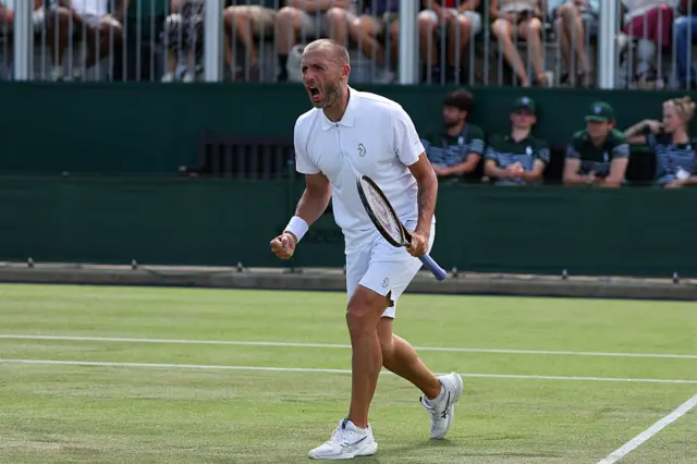 Dan Evans celebrates victory