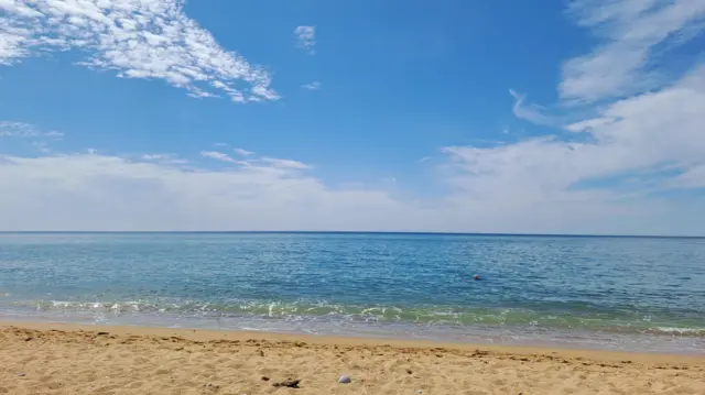 Sand and sea on the coast in Dorset.