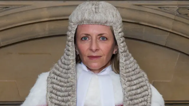Judge Mrs Justice Ellenbogen in a publicity picture wearing full ceremonial robes including a long grey judge's wig and large white fur collar.