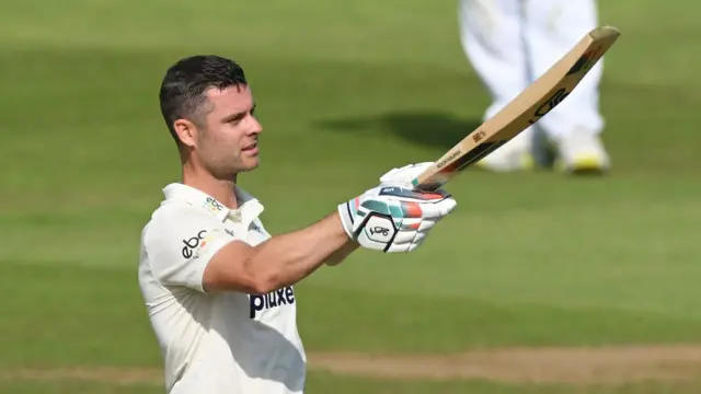 Jake Libby raises his bat