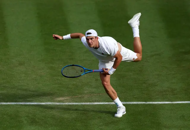 Jack Draper serves at Wimbledon