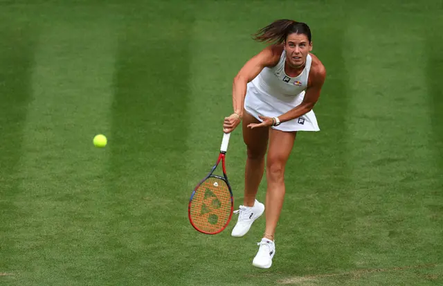 Emma Navarro serves at Wimbledon