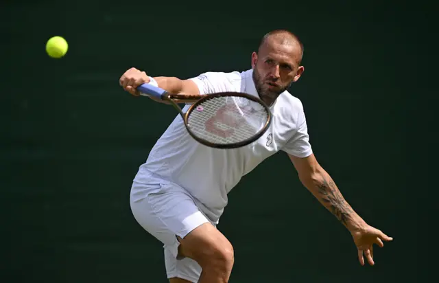Dan Evans plays a backhand