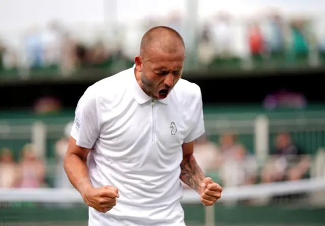 Dan Evans celebrates at Wimbledon