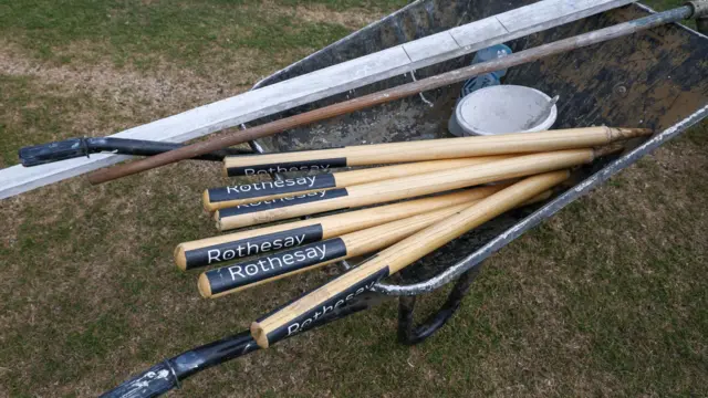 Stumps in wheelbarrow at Grace Road, Leicester