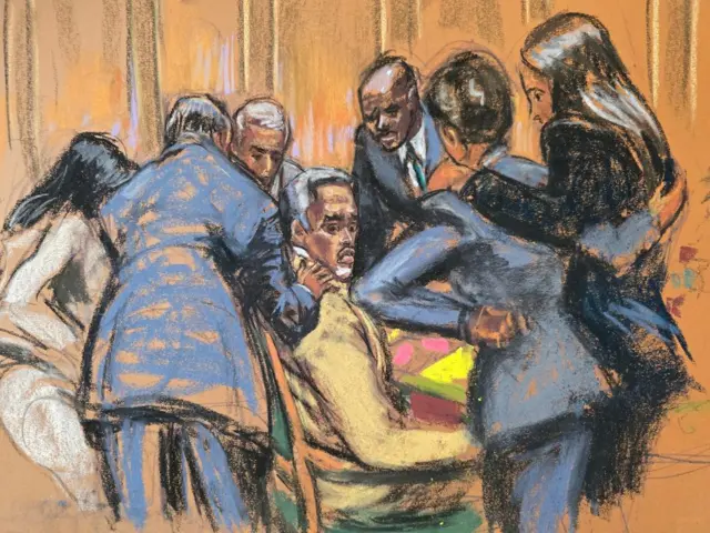 In court sketch, defence lawyers comfort Sean "Diddy" Combs while discussing how to handle a note sent by jurors that they had reached a verdict on four of the five counts against him