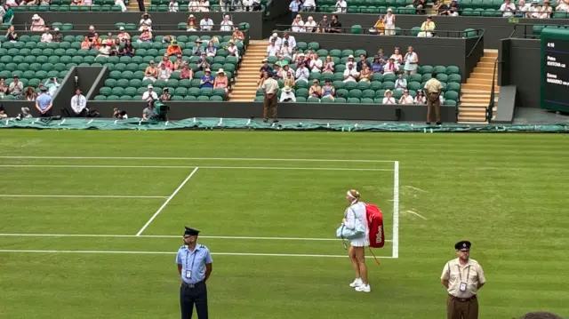 Petra Kvitova walks out on to Court One at WImbledon