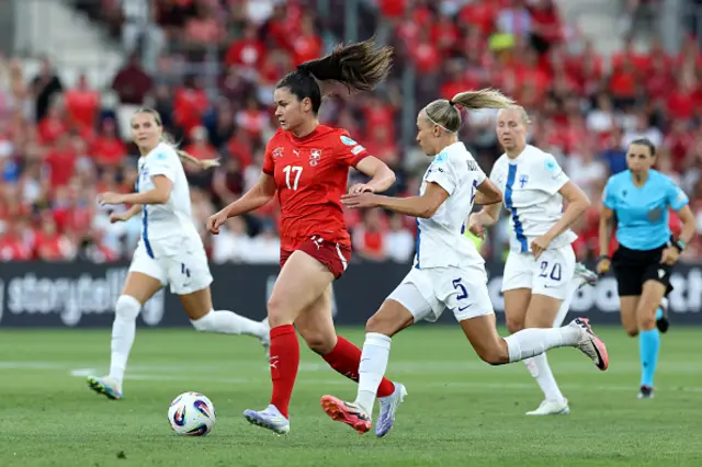 Svenja Foelmli of Switzerland runs with the ball from Emma Koivisto