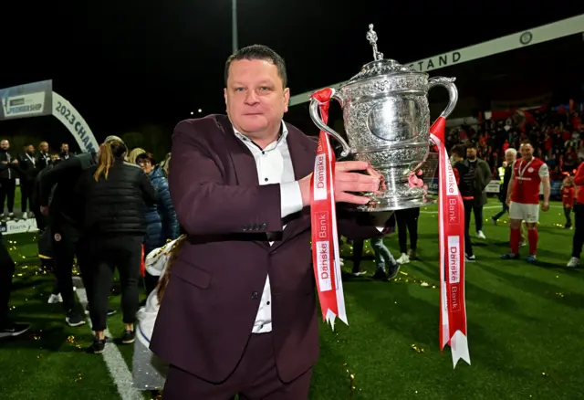 Kenny Bruce holds the Gibson Cup