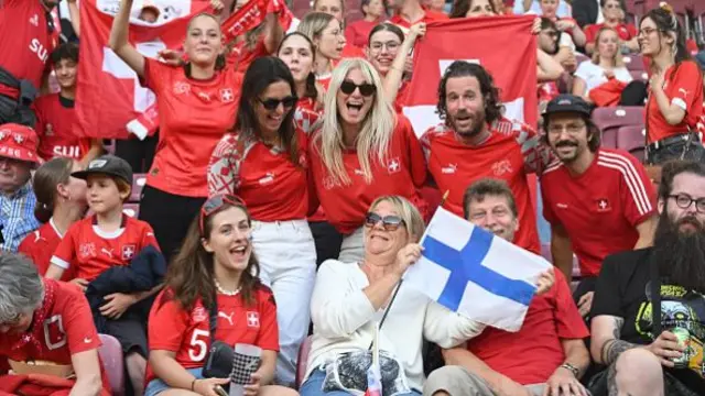 Swiss fans pose