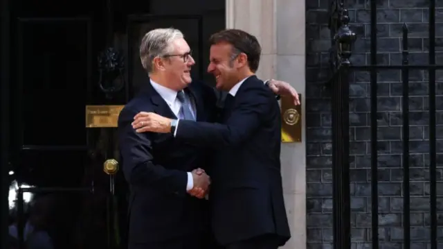 Prime Minister Sir Keir Starmer (left) welcomes President of France Emmanuel Macron to Downing Street on top of a red carpet outside the famous black No 10 door, London, ahead of the UK-France Summit, on day three of his state visit to the UK.