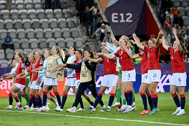 Norway players celebrate in front of their fans at full time