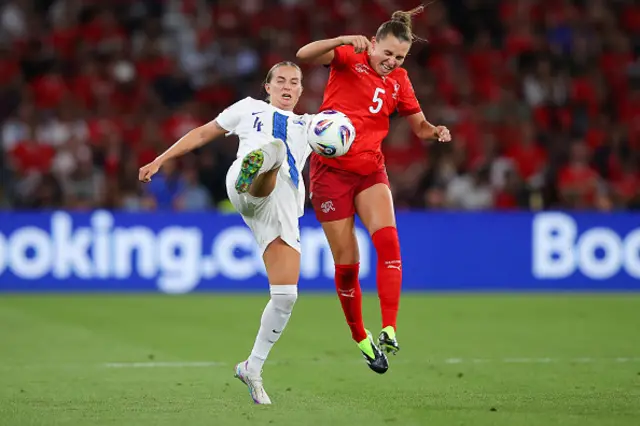 Noelle Maritz of Switzerland battles for possession with Ria Oling