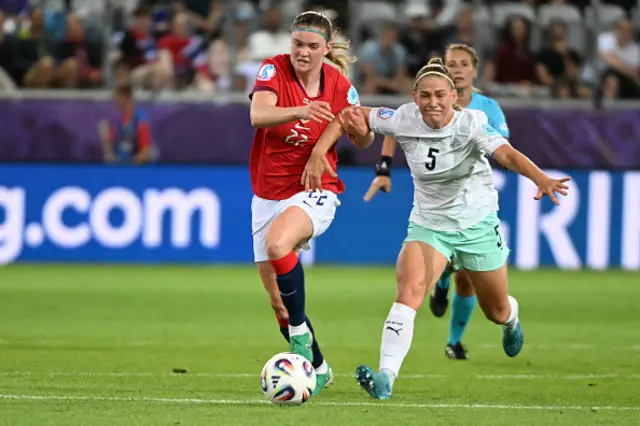 Signe Gaupset of Norway (l) against Saedis Heidarsdottir fight for the ball