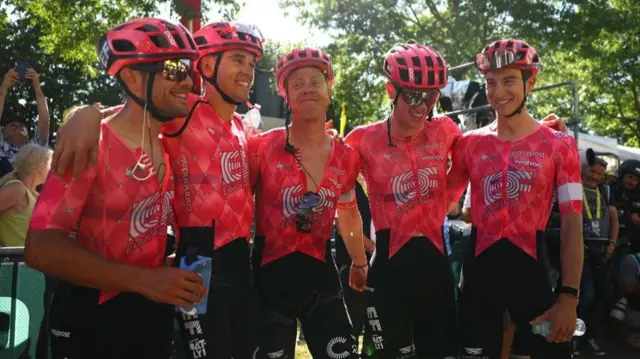 EF Education-EasyPost riders celebrate after team-mate Ben Healy wins stage six of the 2025 Tour de Franceng the trophy ceremony after Ben Healy wins stage
