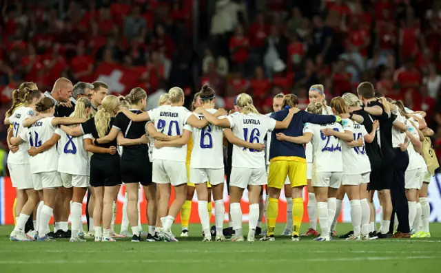 Finland players enter a huddle prior to after the team's elimination