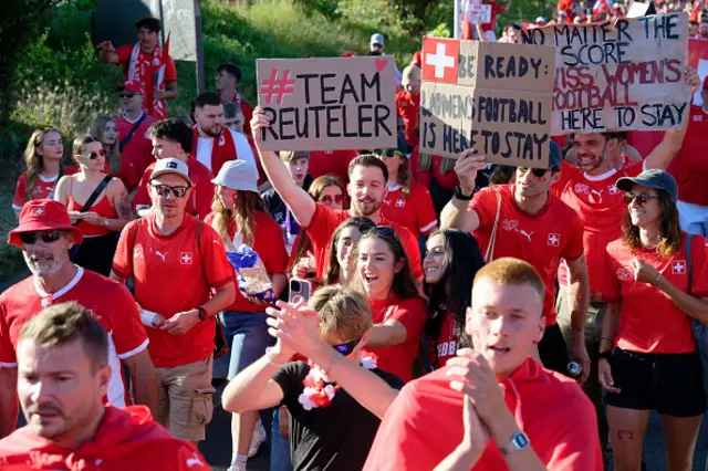 Fans of Switzerland with flags and banner