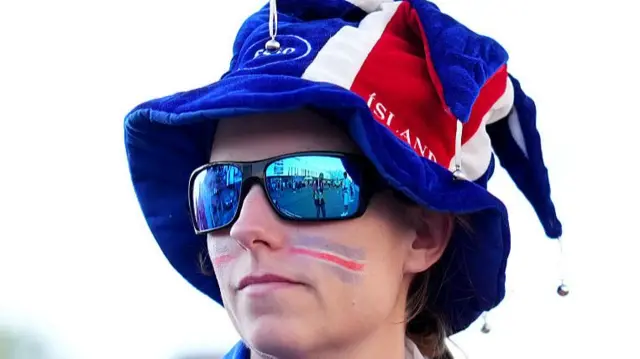 Iceland fan with a hat in the country's colours near Arena Thun