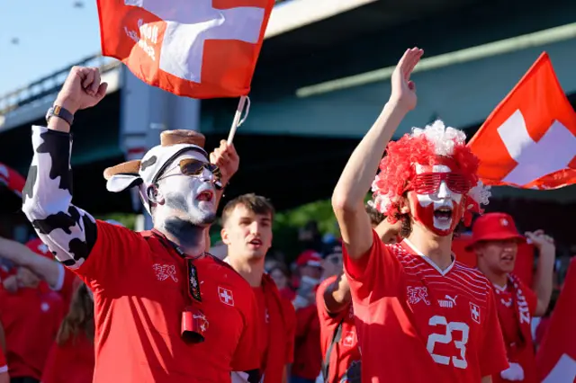 Fans of Switzerland with flags and banner