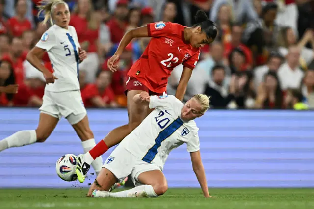 Eveliina Summanen and Switzerland's forward Sydney Schertenleib fight for the ball