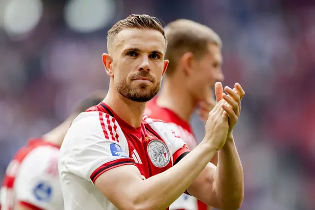 Jordan Henderson applauds Ajax supporters