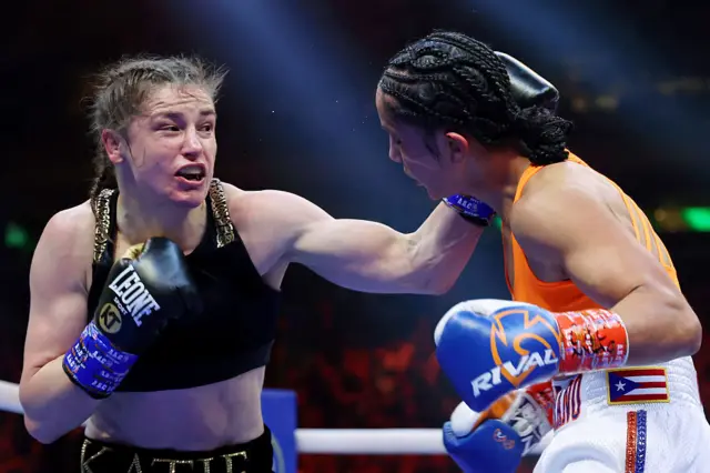 Katie Taylor lands a punch on Amanda Serrano