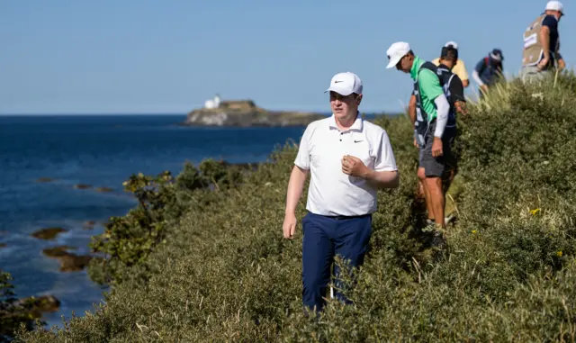 Bob MacIntyre looks for his ball on the 13th