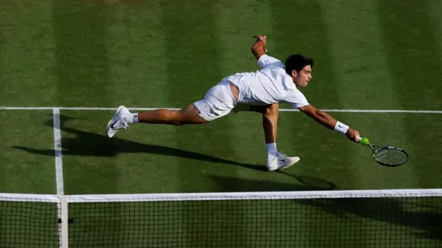 Spain’s Carlos Alcaraz reaches for a ball during his third round match with Germany’s Jan-Lennard Struff