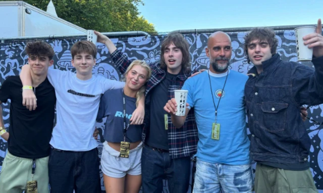 Gallagher children alongside Pep Guardiola