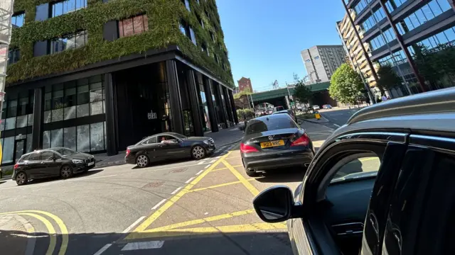 Lots of cars at a standstill in Manchester city centre