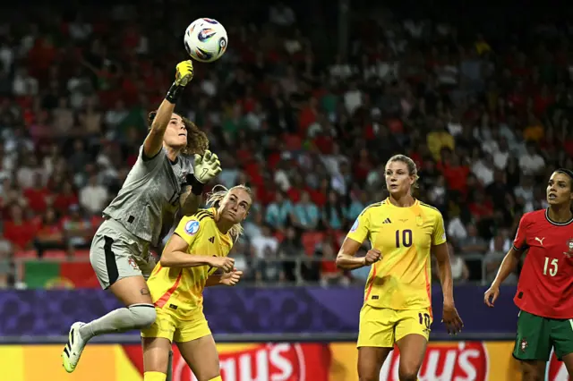 Patricia Morais jumps for the ball against Belgium's forward #09 Tessa Wullaert and Belgium's midfielder #10 Justine Vanhaevermaet