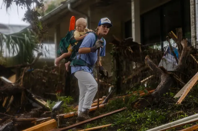 A person sorts through wreckage from Texas floods
