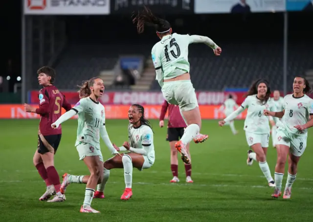 Carole Costa punches the air after scoring from the spot in Leuven