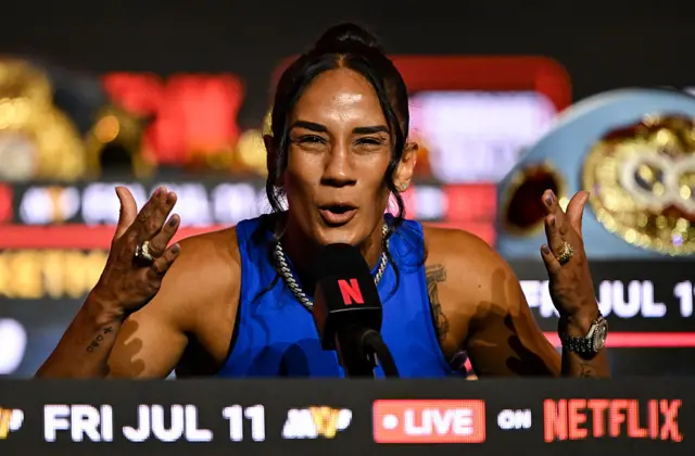 Amanda Serrano holds her hands up as she talks