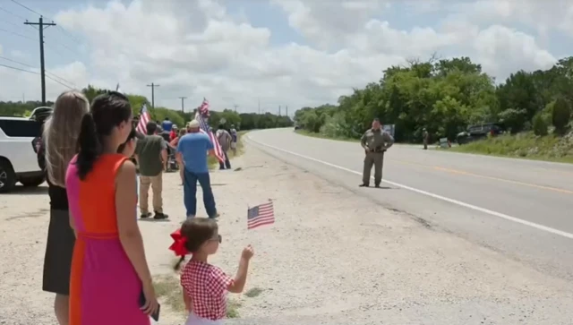 Supporters wait for Trump's motorcade in Texas