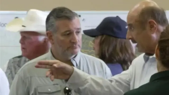 Ted Cruz stands with TV personality Phil McGraw, or Dr. Phil