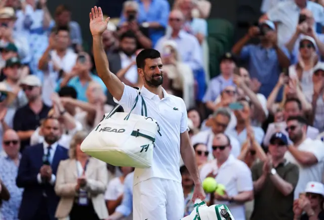 Novak Djokovic waves to Centre Court