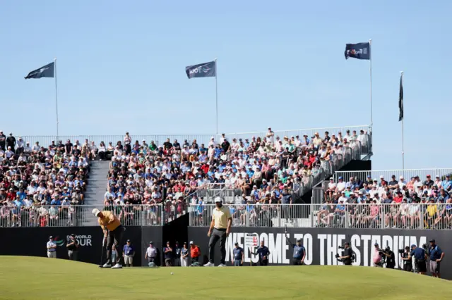 The wind flutters the flags at the grandstand sixth