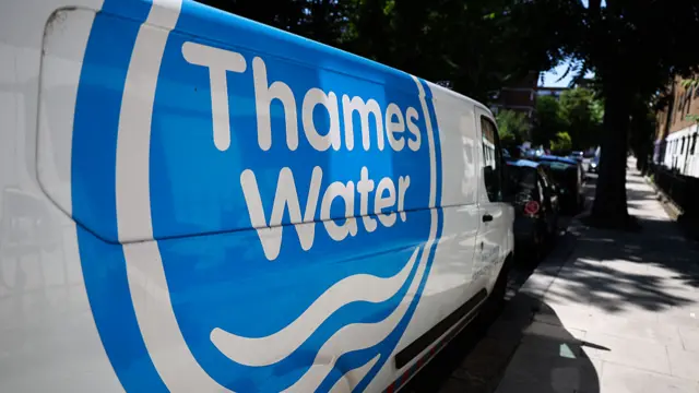 A white van with a blue logo reading Thames Water on the side.