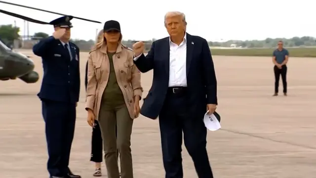 Donald Trump raises fist after arriving in Texas